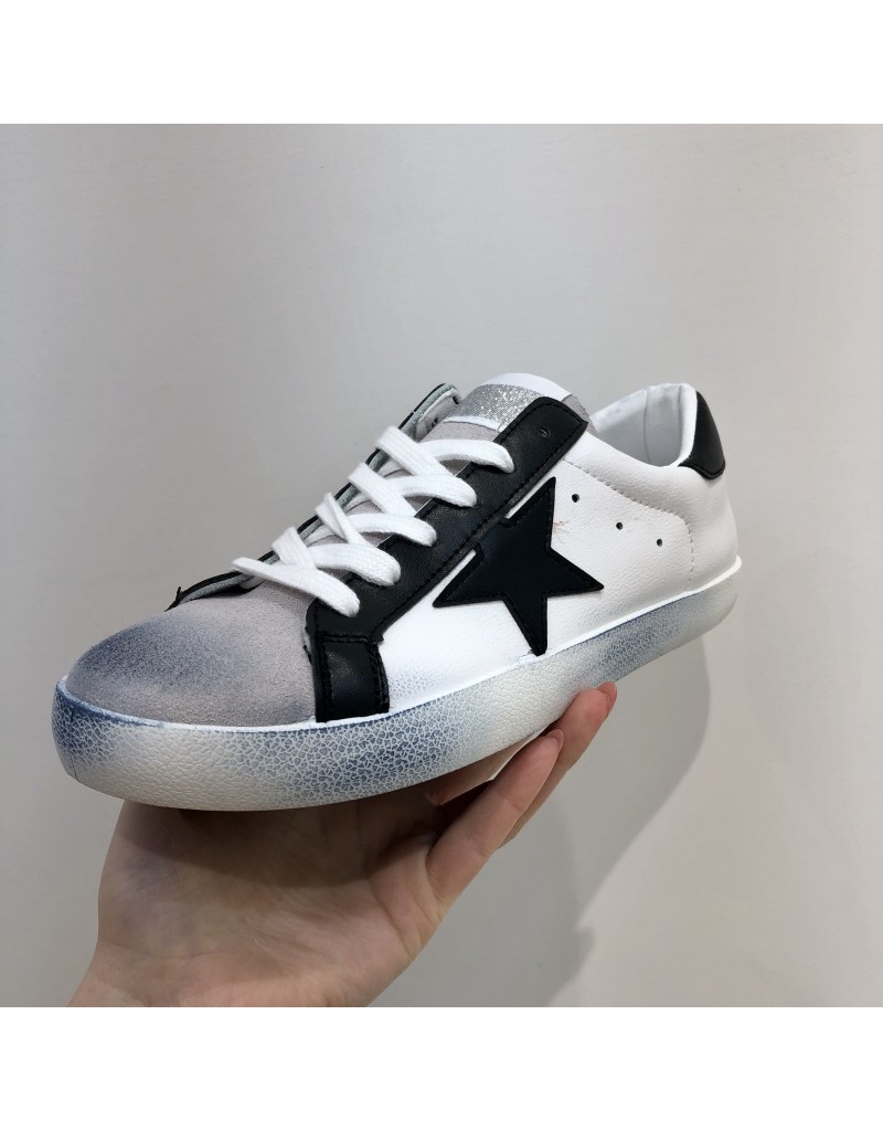 white sneakers with stars on them